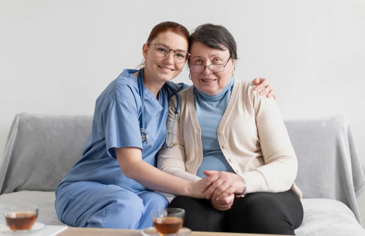 Doctor with her arm around a female patient providing support