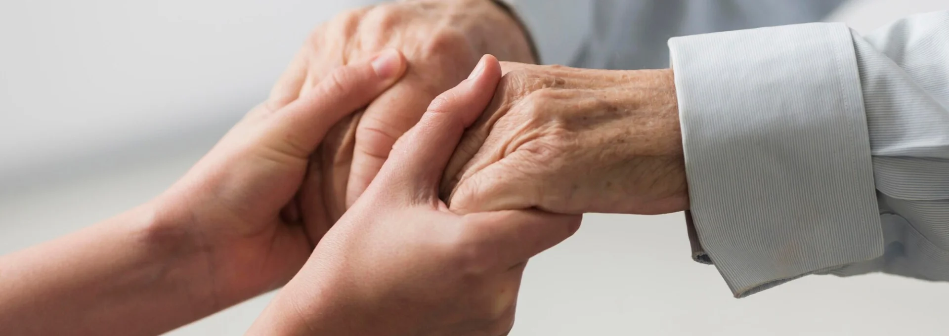 Hands gently holding each other