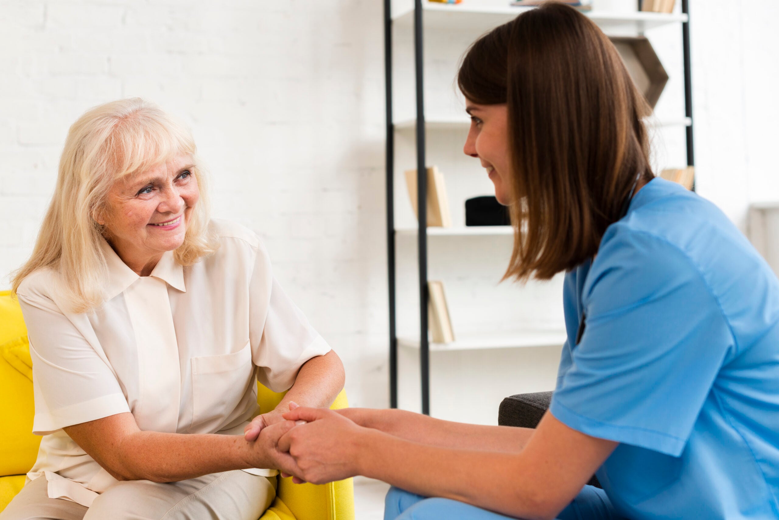 Patient and doctor holding hands