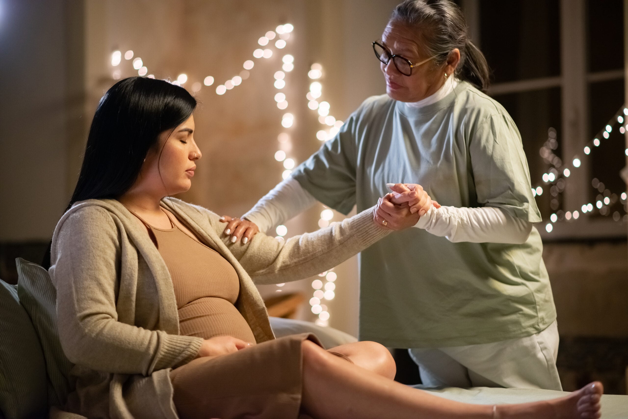 Midwife providing support to pregnant woman