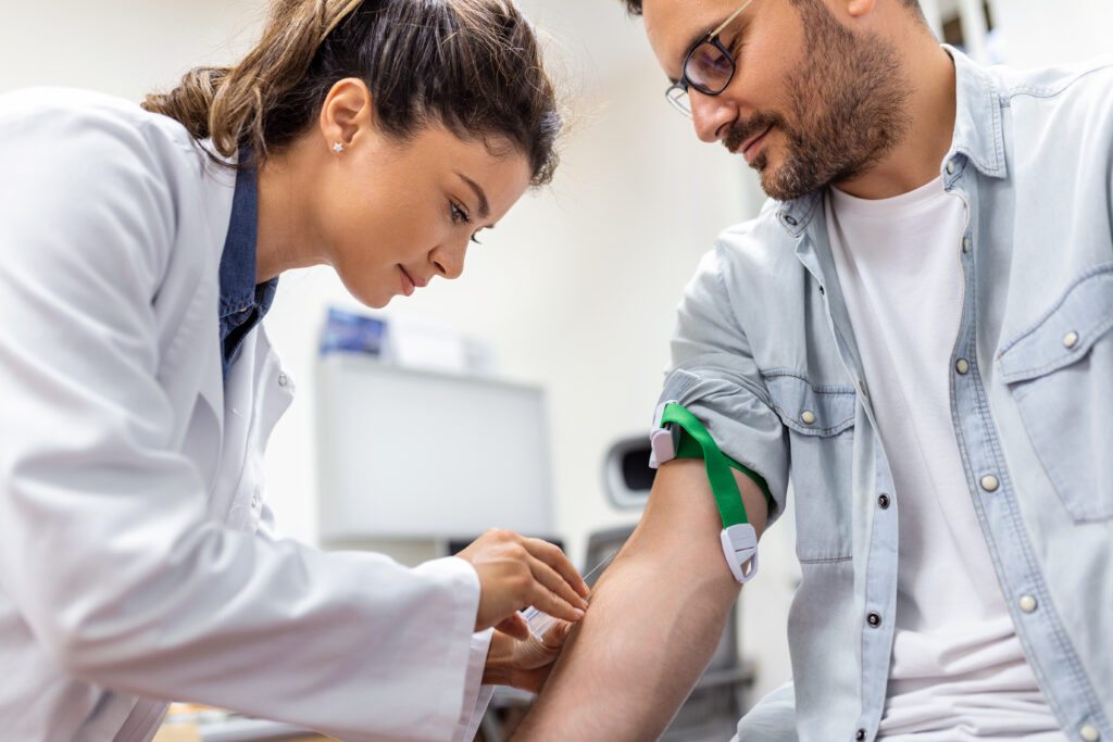 Doctor getting blood sample from patient