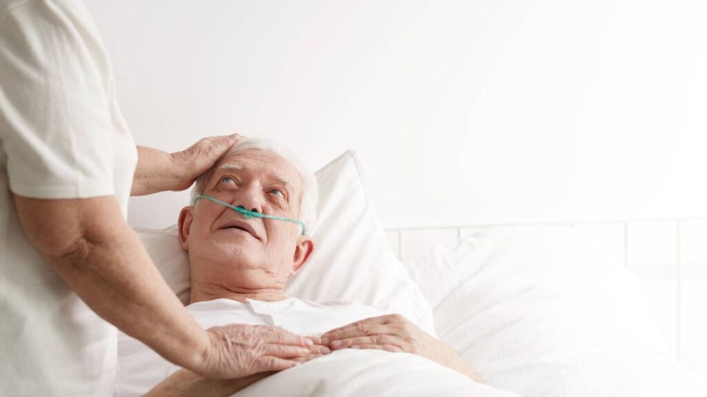 Patient with inserted tube receiving support